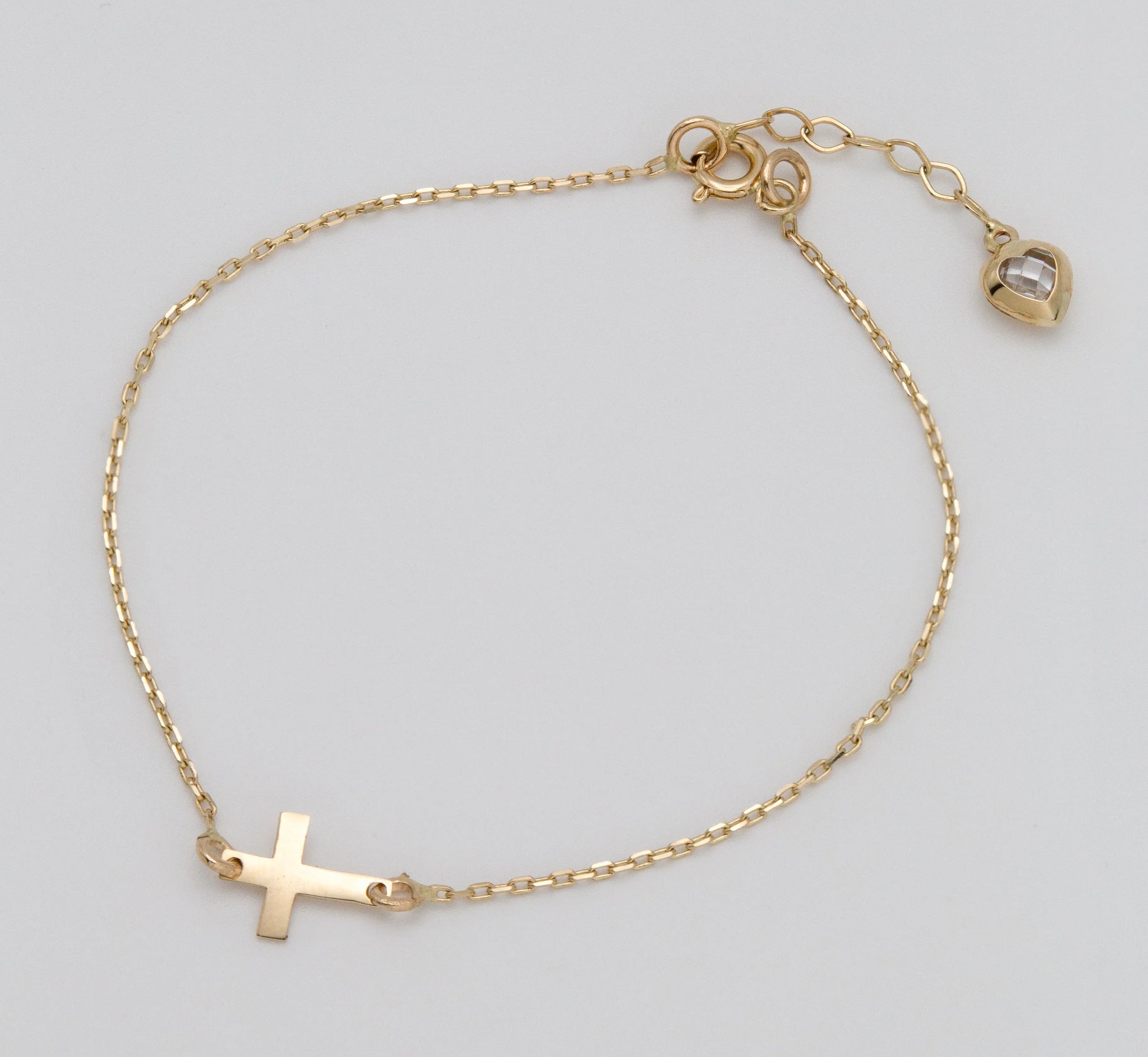 14 KT Yellow Gold Cross Bracelet With White Zircon Heart Shaped Tail TK GOLD